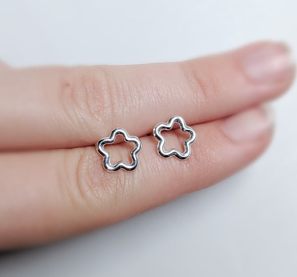 Flower stud earrings made by An American Metalsmith