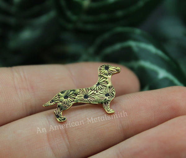 Brass dachshund pin with daisy stamps made by An American Metalsmith