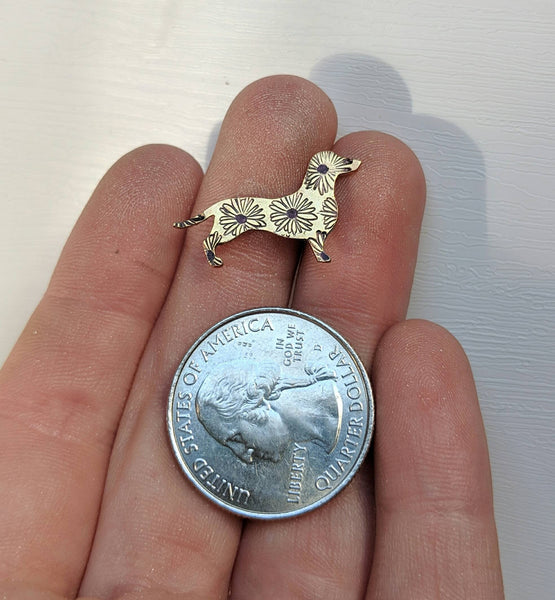 Brass dachshund pin with daisy stamps made by An American Metalsmith