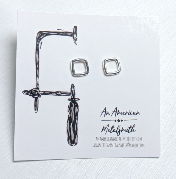Square stud earrings made by An American Metalsmith