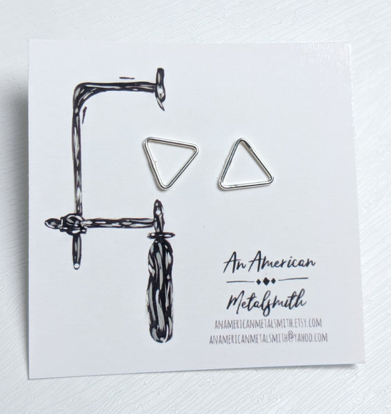 Triangular stud earrings made by An American Metalsmith