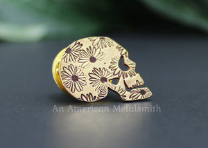 Brass skull pin with daisy print made by An American Metalsmith