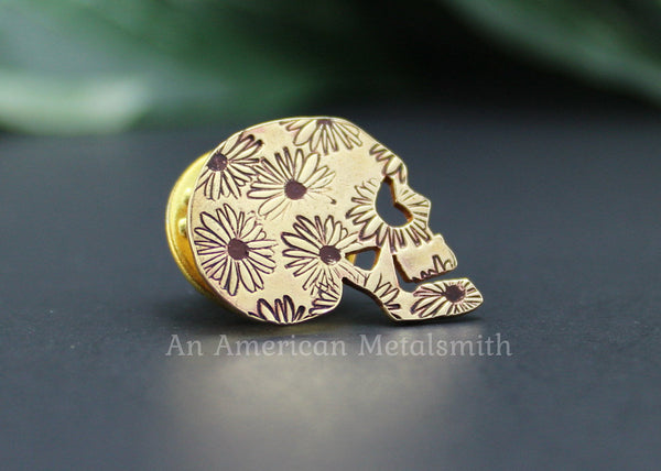 Brass skull pin with daisy print made by An American Metalsmith